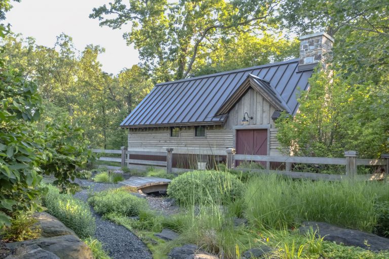 Rustic estate home nestled in mature woodland — Kane Brothers luxury landscape design